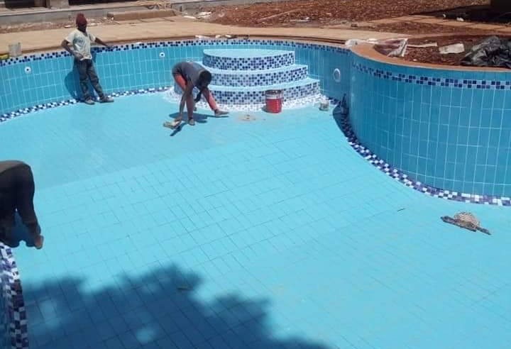 Cost of tiling a standard swimming pool in Kenya using glass mosaic versus ceramic